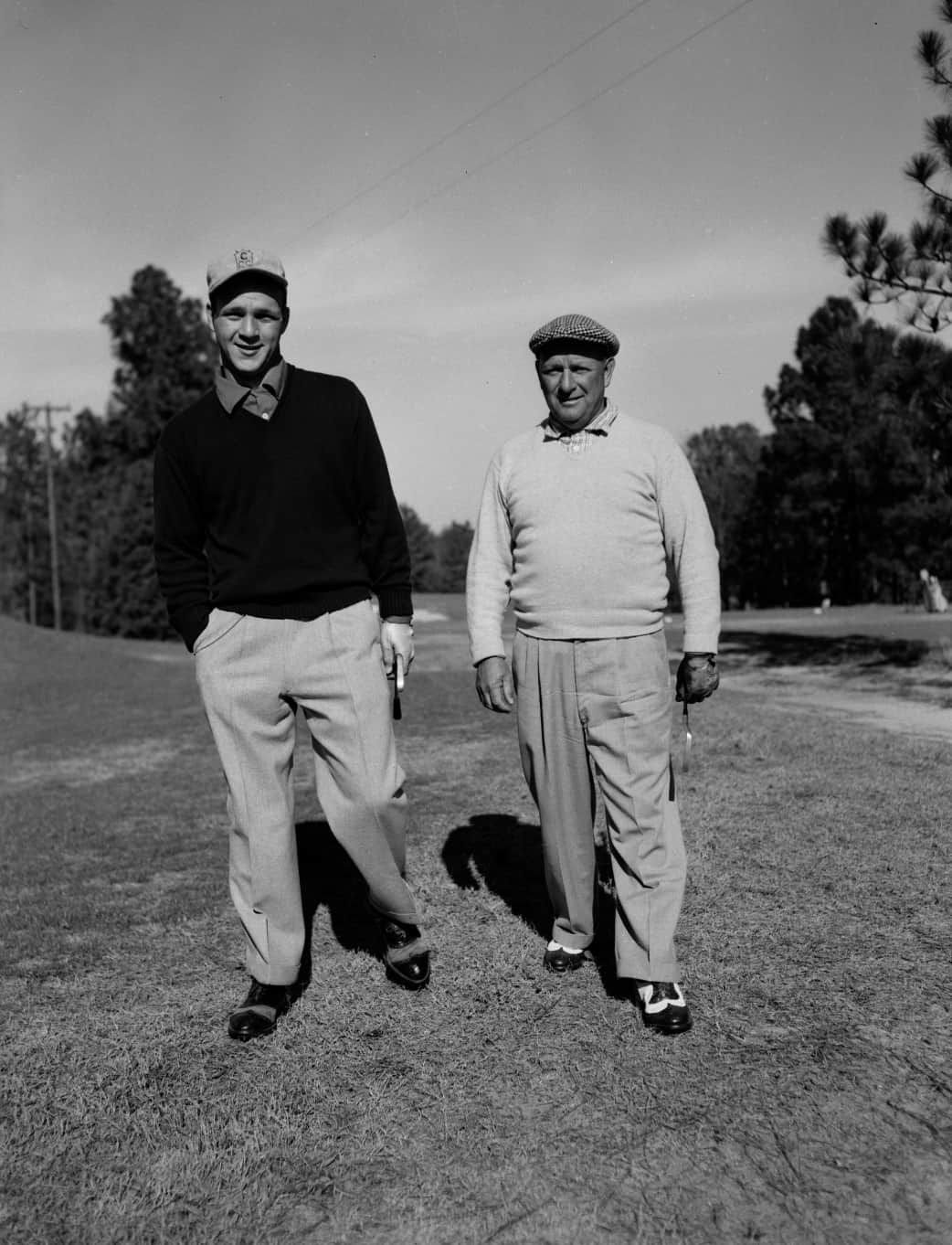 Arnold Palmer and his father Deacon on the 9th hole of Pinehurst No. 2 in 1954. (Photo Courtesy of the Tufts Archives)