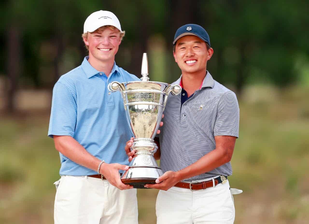 Frankie Capan and Ben Wong stand with the U.S. Amateur Four-Ball trophy on Pinehurst No. 2. (Copyright: USGA/Chris Keane)