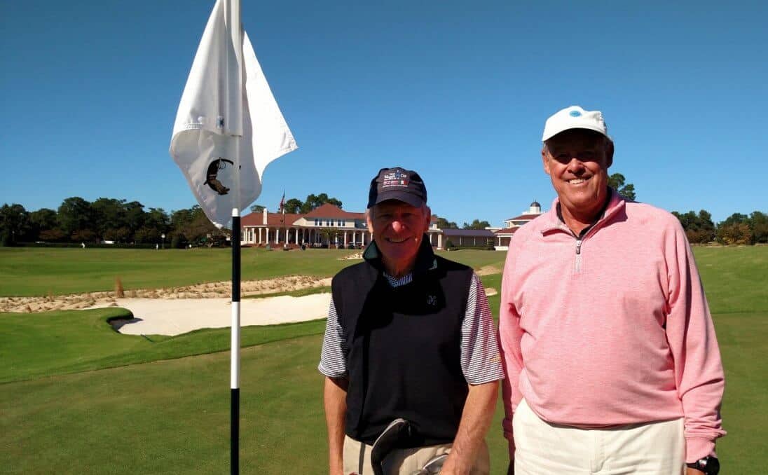 Paul Rudovsky, left, stands on the 3rd green of The Cradle with Pinehurst Country Club member Jim Rohr on Wednesday, Oct. 18. The Cradle was the 1,000th golf course Rudovsky has played in his lifetime.
