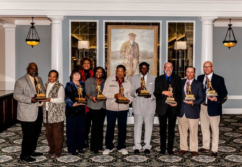 The Pinehurst Caddie Hall of Fame welcomed its second class on Wednesday night in the St Andrews Room at the Resort Clubhouse. The inductees are (l-r), Junior Lewis and Connie West (grandson and niece of caddie Jimmy Steed of the 2001 inaugural class), Janet Daigle (life partner of the late caddie Charlie Spain), Phyllis and Patricia Jones (sisters of the late caddie Jesse Jones), caddie Bobby Hill, caddie John Ross, caddie Bob Scheirer, caddie Thomas Trinchitella and caddiemaster Jimmy Smith. (Photo by John Gessner)