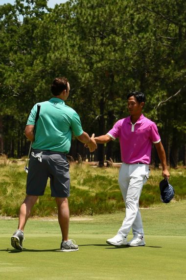 Eric Bae, right, shakes hands with Matt Parziale after Bae won their Round of 32 match in 19 holes in the 119th North & South Amateur on Thursday on Pinehurst No. 2. (Photo by John Patota)