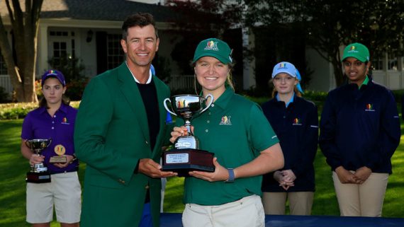 North Carolina prep star Katherine Schuster accepts the Drive, Chip & Putt trophy from Masters Champion Adam Scott in April, 2018.
