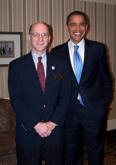 Scott Brewton, Pinehurst’s Senior Vice President and General Manager, poses with Barack Obama at the Carolina Hotel in 2008.