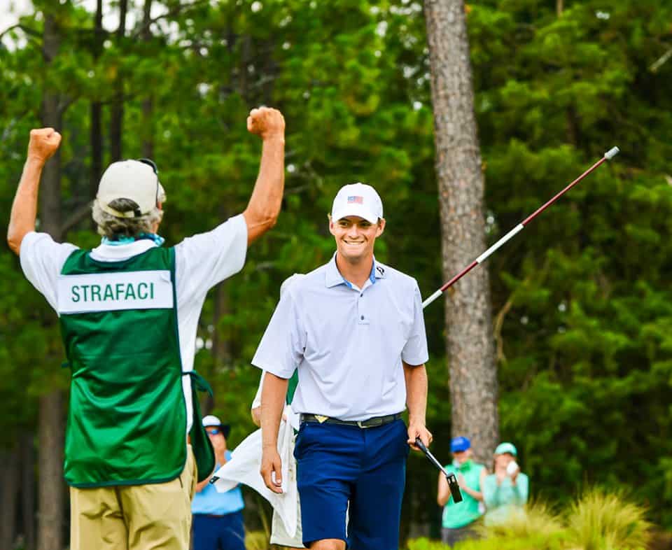 Father and caddie Frank Strafaci Jr. raises his arms to celebrate son Tyler’s triumph in the North & South.