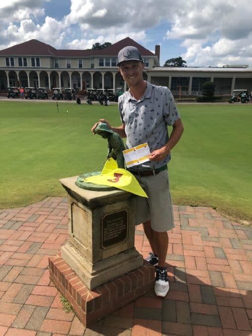 Patrick Scheil stands with the Putter Boy after his magical round on Pinehurst No. 3.