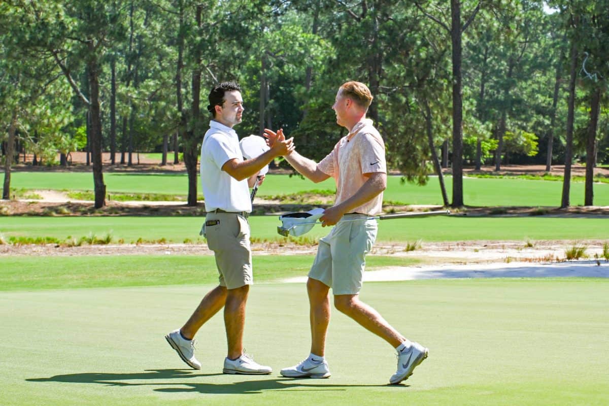 Finigan Tilly (left) and Christian Banke shake hands following Tilly’s win in the Round of 32 match of the 121st North & South Amateur on Pinehurst No. 2. Banke was the top seed and medalist. (Photo by John Patota)