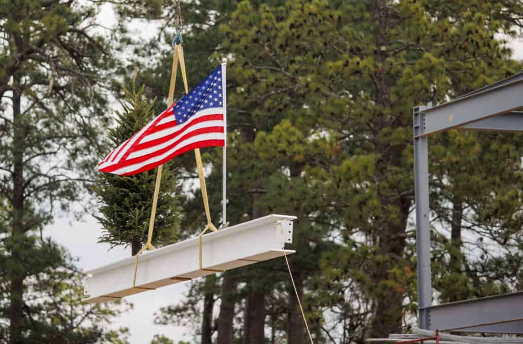 The final beam is lifted into place during the USGA Golf House Testing Center and Administration Building Topping Out Ceremony at Golf House Pinehurst in Village of Pinehurst, N.C. on Thursday, Jan. 19, 2023. (Copyright USGA/Chris Keane)