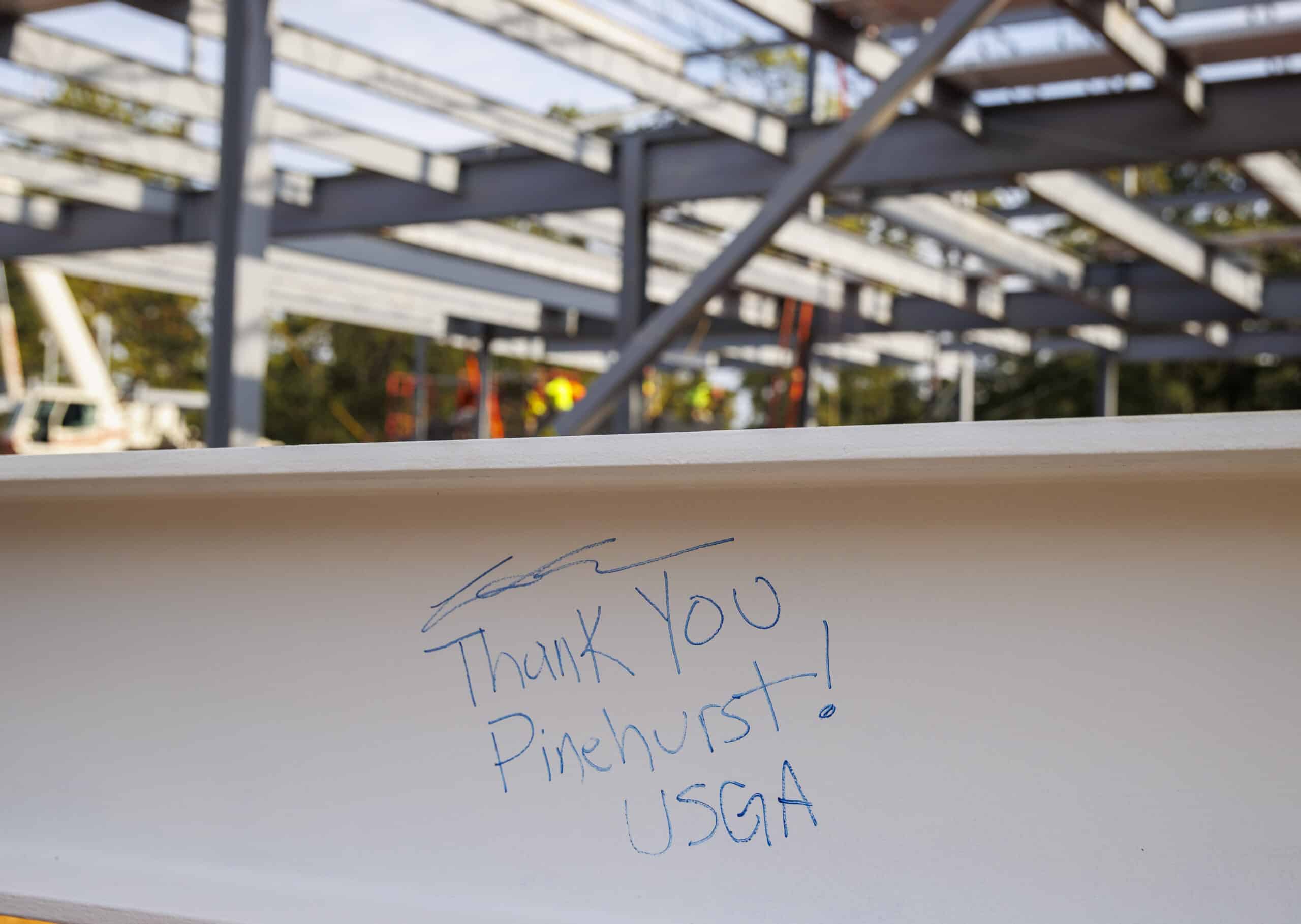 The final beam is seen during the USGA Golf House Testing Center and Administration Building Topping Out Ceremony at Golf House Pinehurst in Village of Pinehurst, N.C. on Thursday, Jan. 19, 2023. (Copyright USGA/Chris Keane)