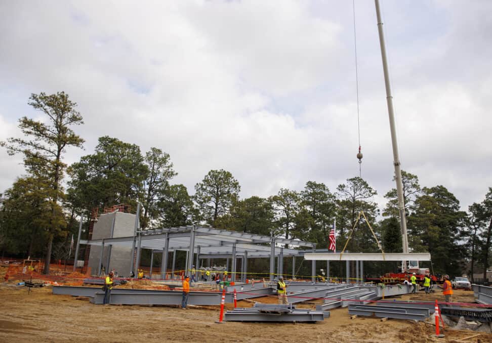 The final beam is lifted into place during the USGA Golf House Testing Center and Administration Building Topping Out Ceremony at Golf House Pinehurst in Village of Pinehurst, N.C. on Thursday, Jan. 19, 2023. (Copyright USGA/Chris Keane)