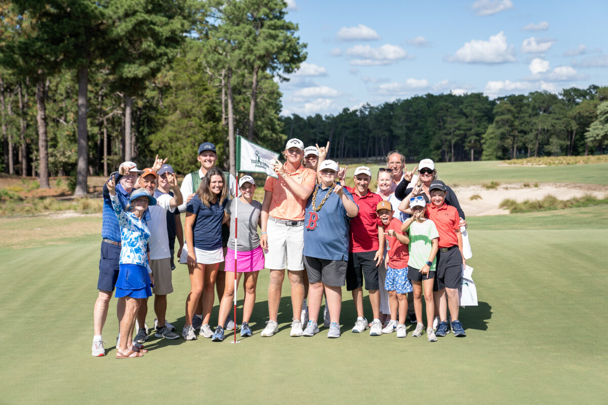 Tommy Morrison is surrounded by his family and friends after winning his semifinal match on Pinehurst No. 2. (Photo by Matt Gibson)