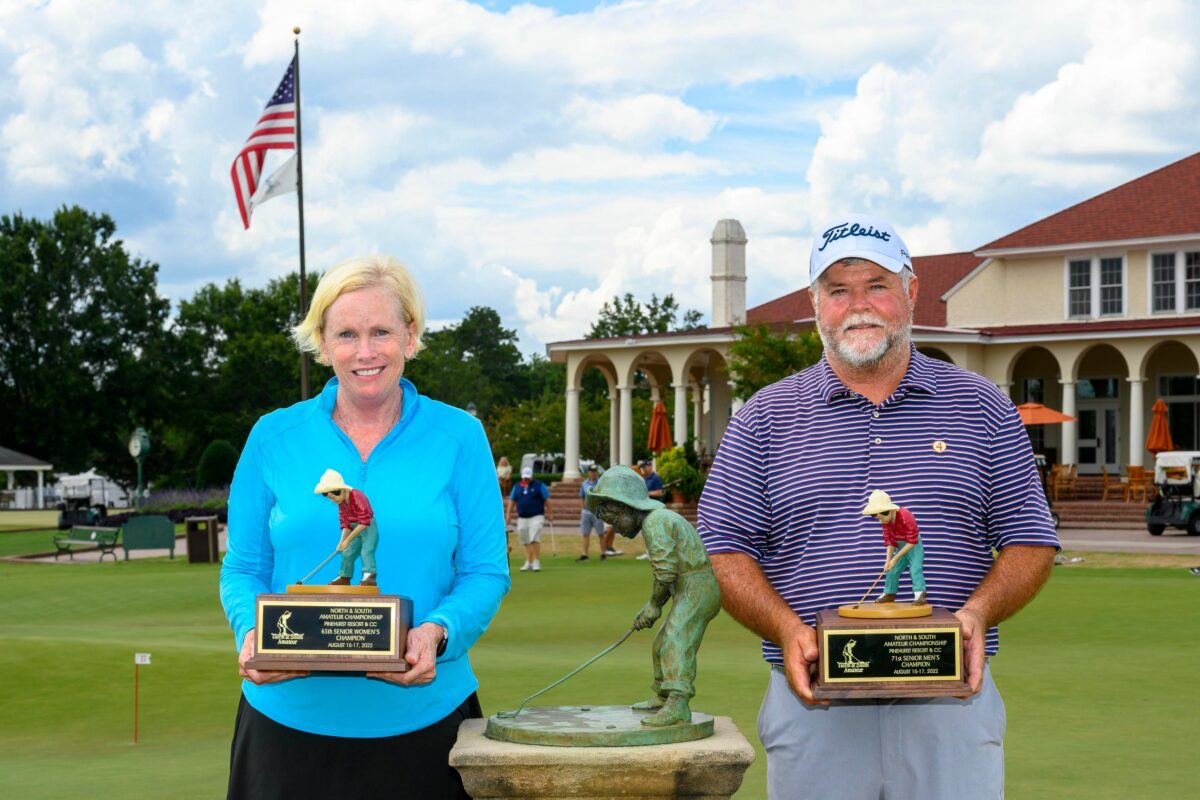 Sherrill Britt (right) and Kathy Hartwiger pose with their first Putter Boy Trophies after winning the Men’s and Women’s Senior North & South Amateurs on Wednesday. (photo by John Patota)