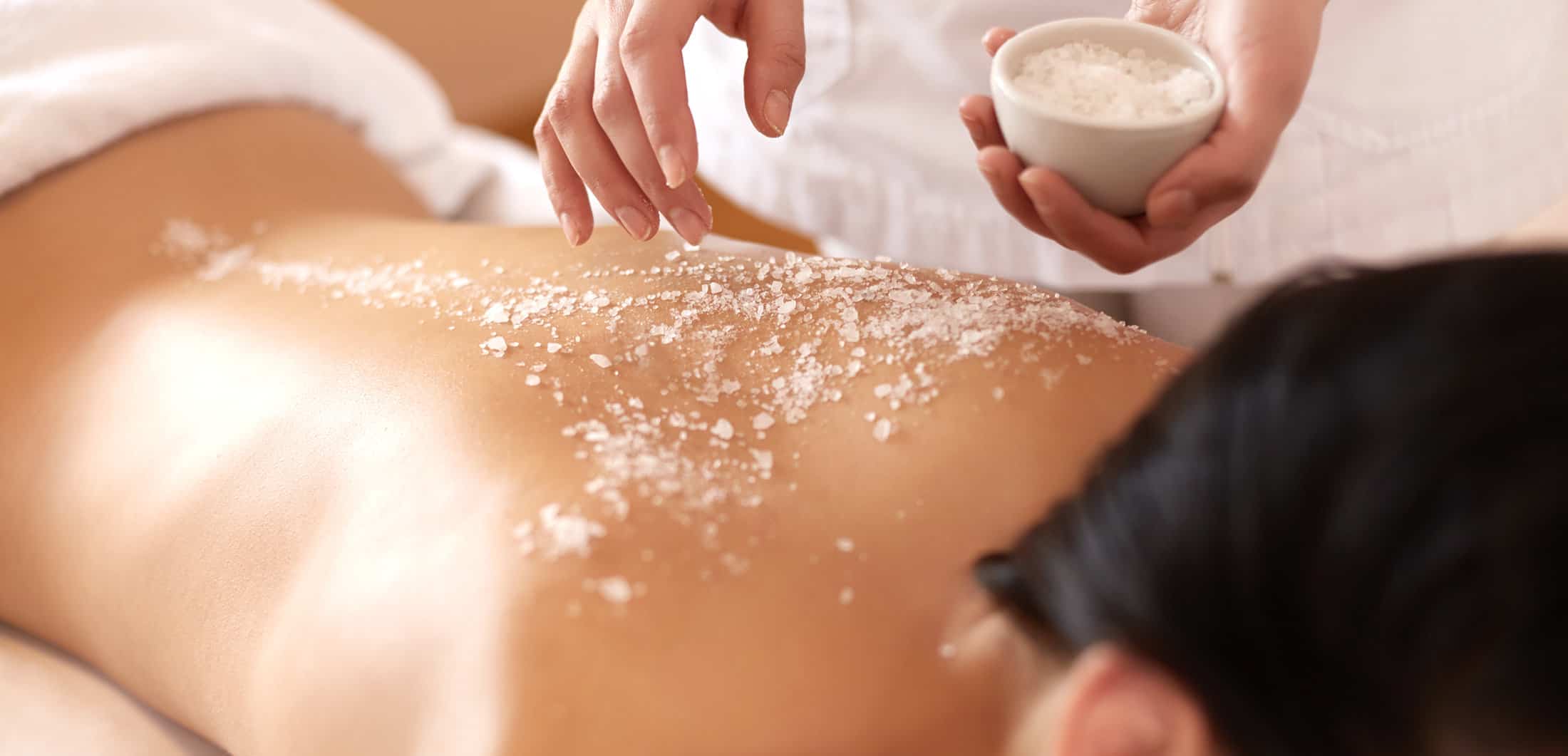 woman indulging in spa body treatments and body care at Pinehurst Spa