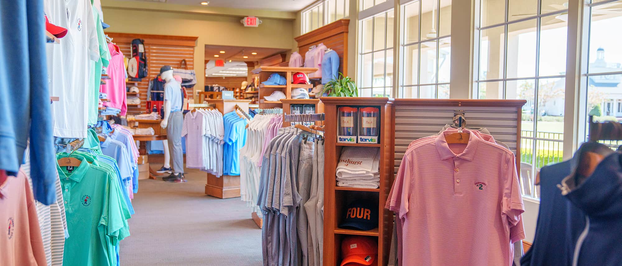 Shopping at the Pinehurst pro shop including mens golf polos and mens hats