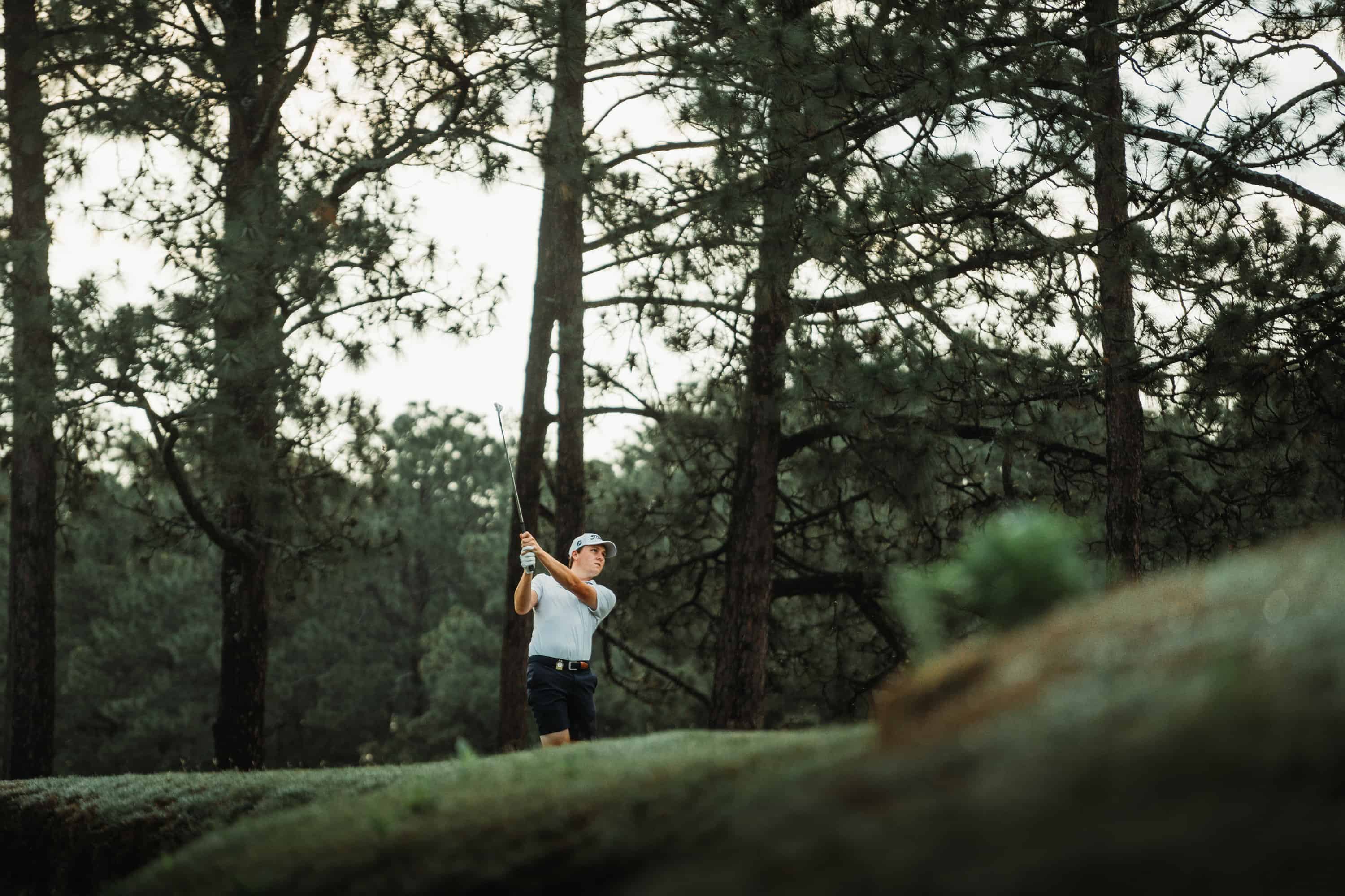 Alex Price tees off on Pinehurst No. 4. (Photo by Zach Pessagno)