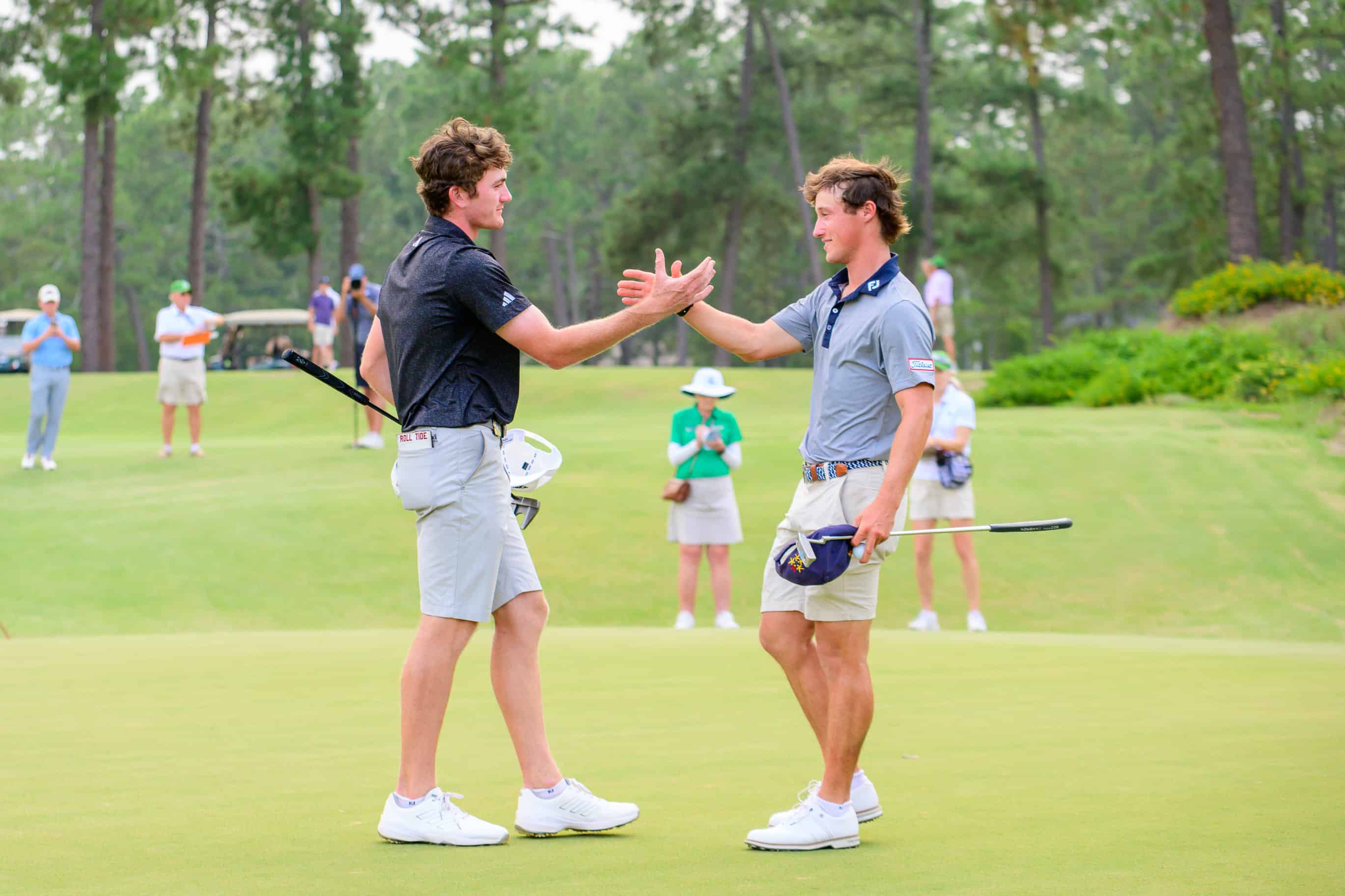 Nick Dunlap and David Ford shake hands after Dunlap's win on Friday. (Photo by John Patota)