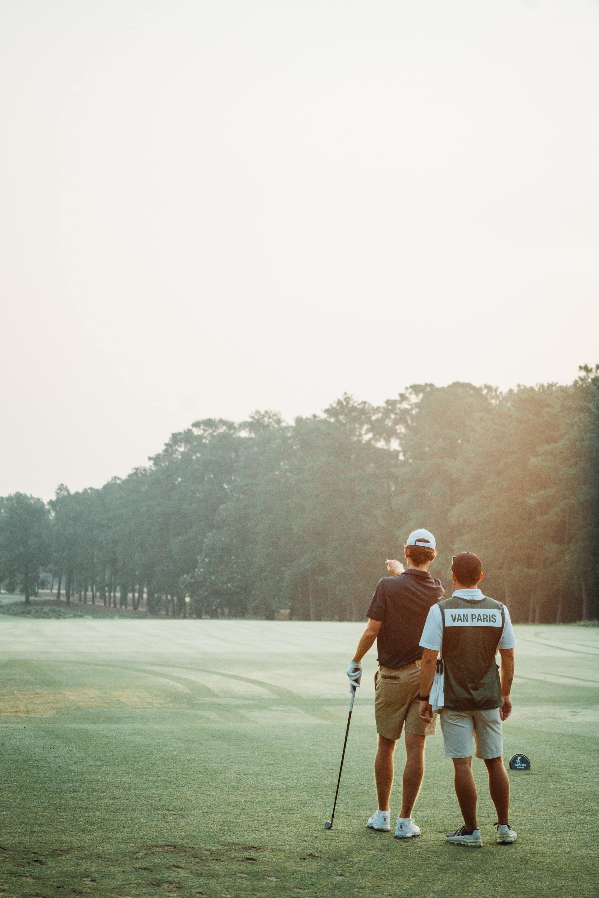 Jackson Van Paris confers with his caddie. (Photo by Zach Pessagno)