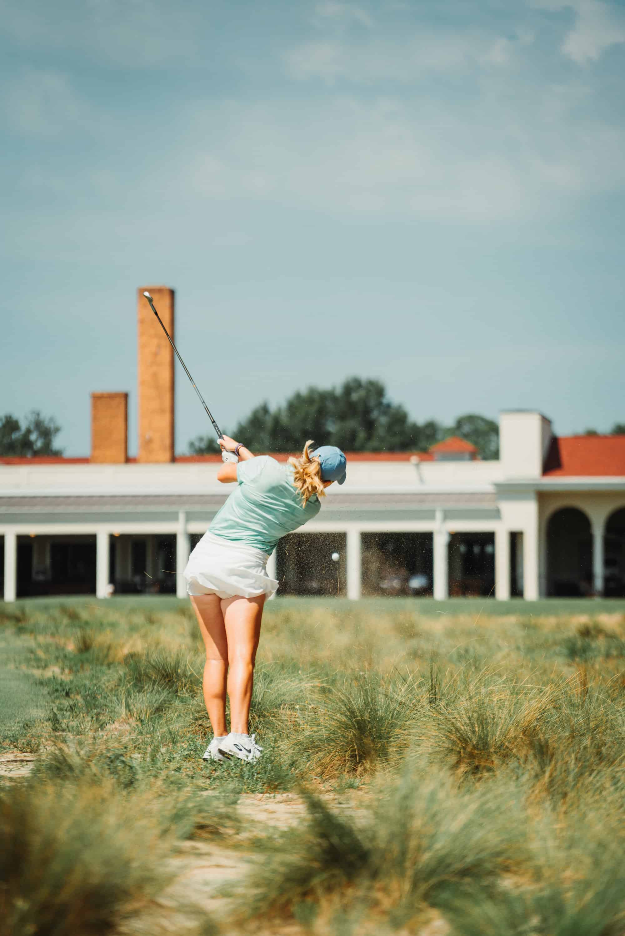 Anna Morgan advances her ball out of the native area on the 18th hole of Pinehurst No. 2. (Photo by Zach Pessagno)