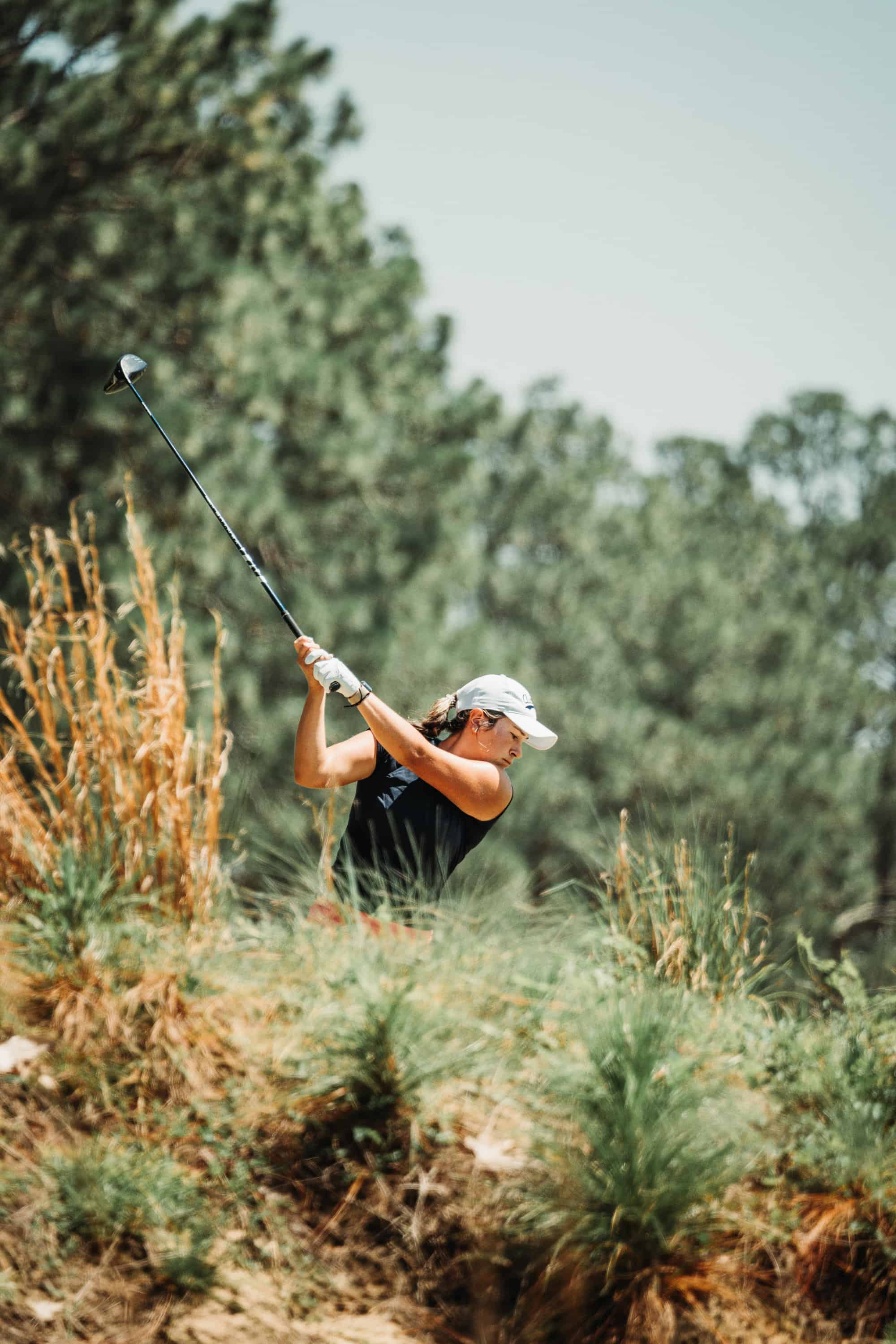 Megan Schofill hits her tee shot on Pinehurst No. 4. (Photo by Zach Pessagno)