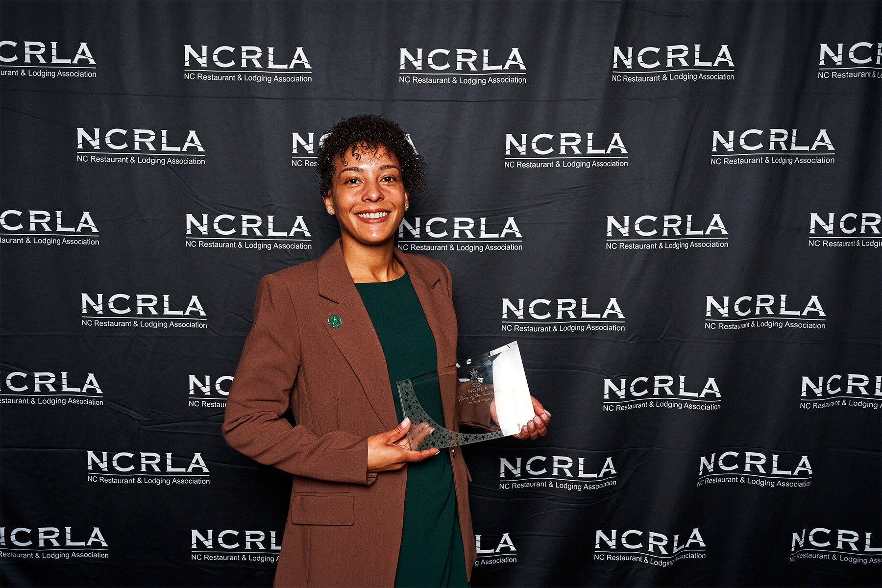 Pinehurst’s Porcha Overbey accepts the NCRLA Lodging Employee of the Year Award