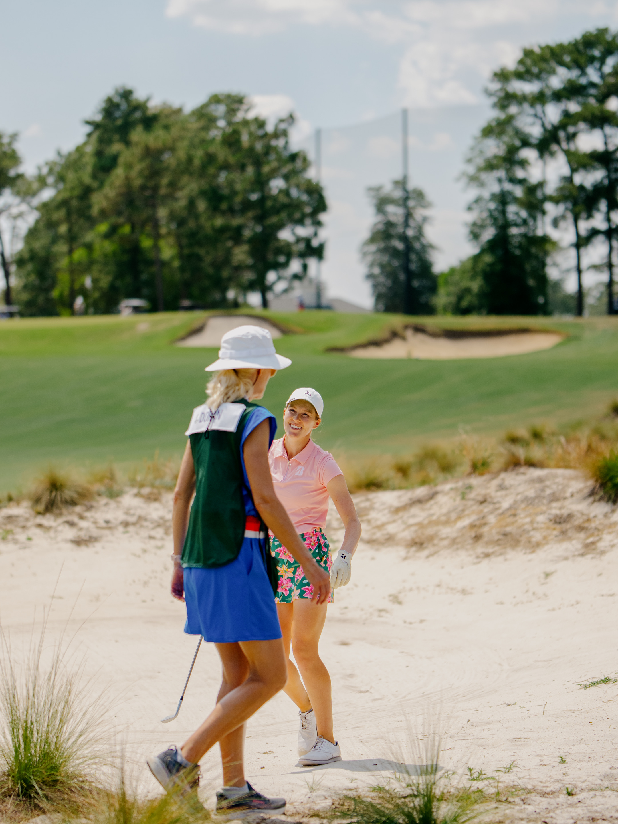 Emilia Doran reacts after playing from the bunker.